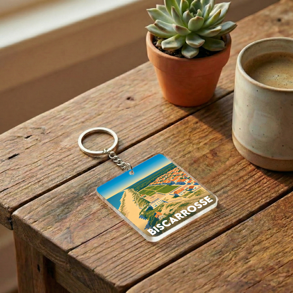 Porte-clés souvenir de la ville de Biscarrosse avec une illustration stylisée de son littoral.