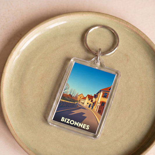 Porte-clés souvenir de la ville de Bizonnes avec une illustration stylisée.