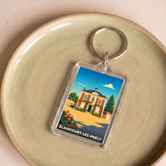 Porte-clés souvenir de la ville de Blaincourt-lès-Précy avec une illustration stylisée de sa mairie.