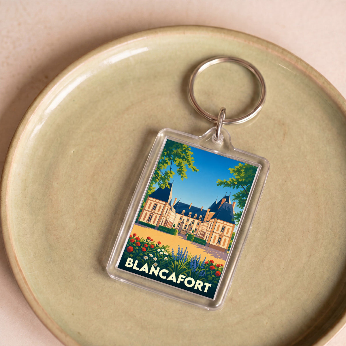 Porte-clés souvenir de la ville de Blancafort avec une illustration stylisée de son château.