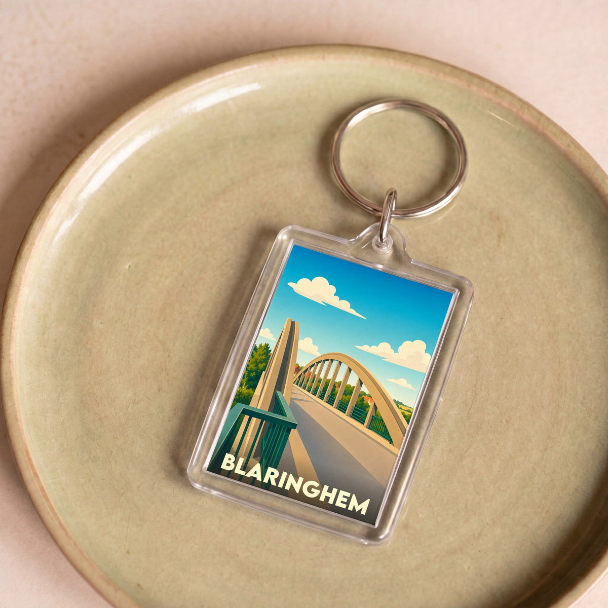 Porte-clés souvenir de la ville de Blaringhem avec une illustration stylisée d'un pont.