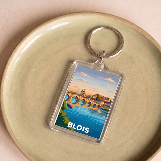 Porte-clés souvenir de la ville de Blois avec une illustration stylisée.