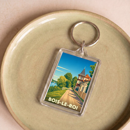 Porte-clés souvenir de la ville de Bois-le-Roi avec une illustration stylisée.