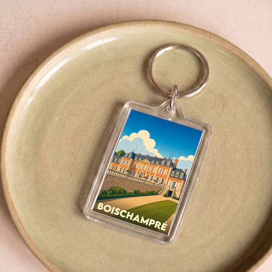 Porte-clés souvenir de la ville de Boischampré avec une illustration stylisée du château.