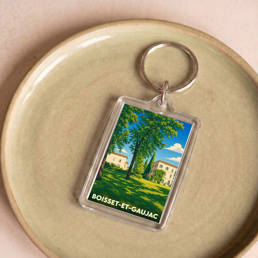 Porte-clés souvenir de la ville de Boisset-et-Gaujac avec une illustration stylisée d'un domaine arboré.