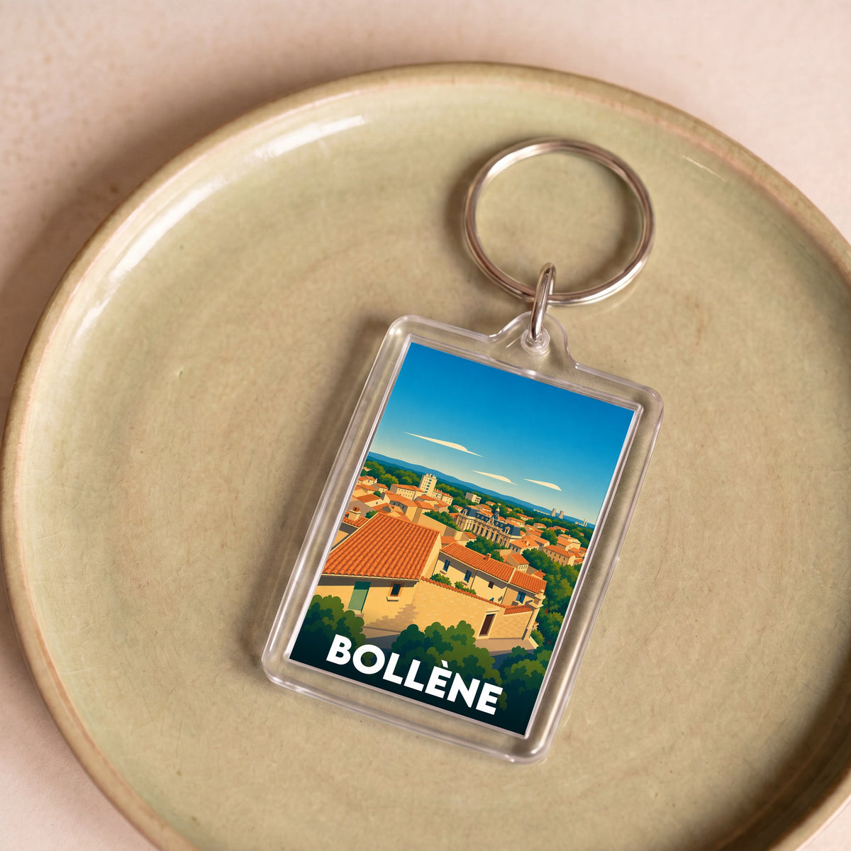 Porte-clés souvenir de la ville de Bollène avec une illustration stylisée.