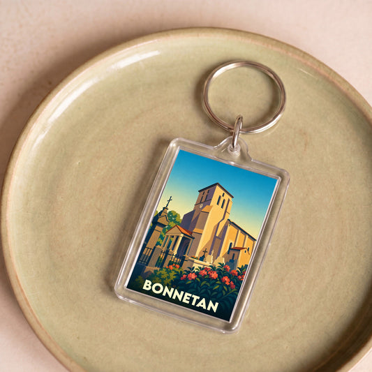 Porte-clés souvenir de la ville de Bonnetan avec une illustration stylisée de son église.