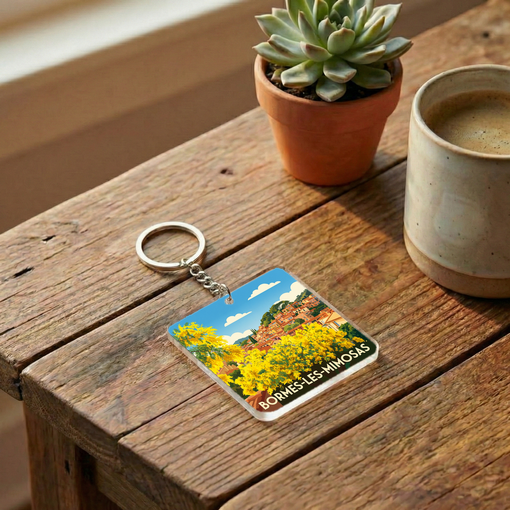Porte-clés souvenir de la ville de Bormes-les-Mimosas avec une illustration stylisée.