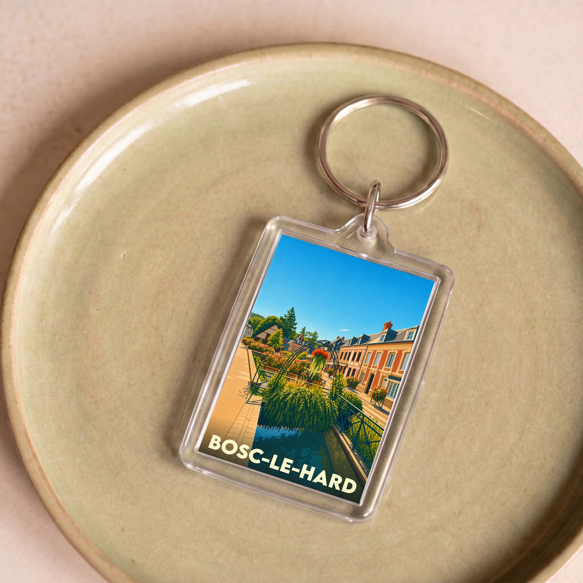 Porte-clés souvenir de la ville de Bosc-le-Hard avec une illustration colorée et stylisée.