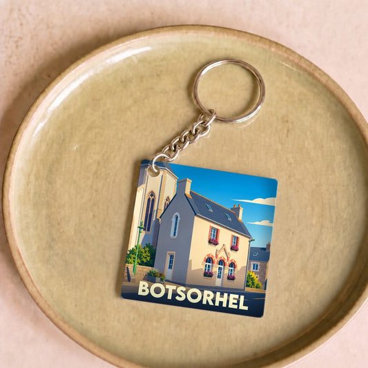 Porte-clés souvenir de la ville de Botsorhel avec une illustration stylisée.