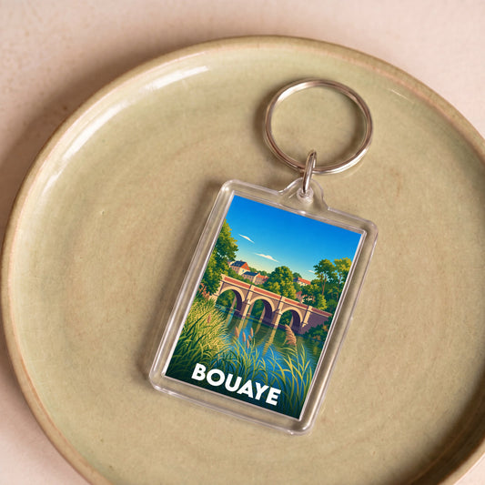 Porte-clés souvenir de la ville de Bouaye avec une illustration stylisée d'un pont en pierre.