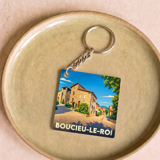Porte-clés souvenir de la ville de Boucieu-le-Roi avec une illustration stylisée.