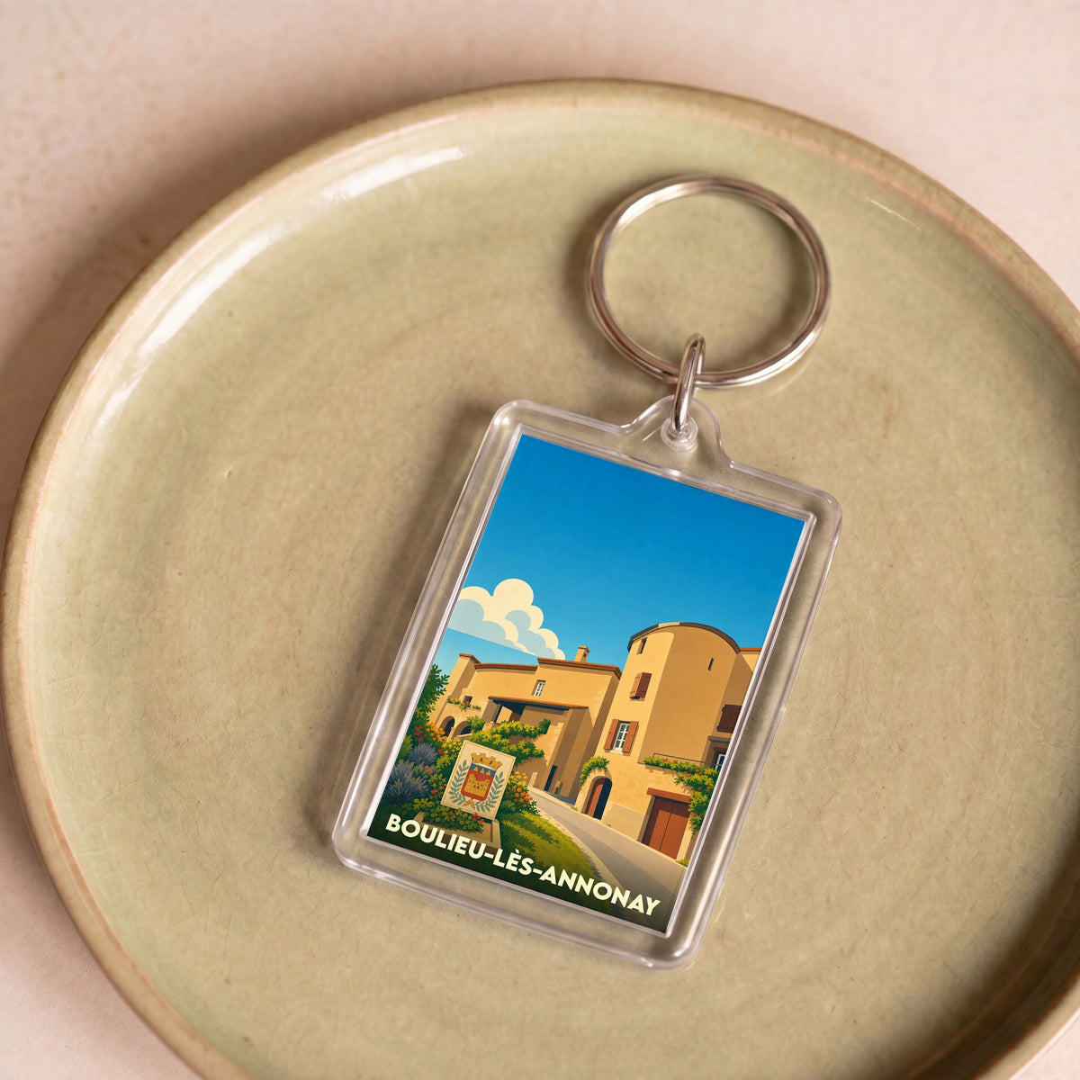 Porte-clés souvenir de la ville de Boulieu-lès-Annonay avec une illustration stylisée.