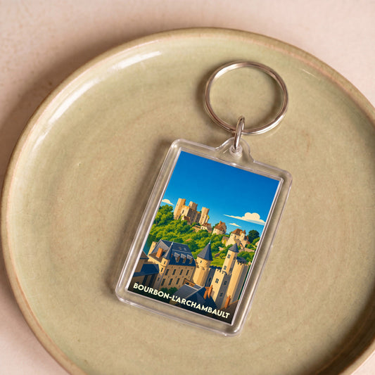 Porte-clés souvenir de Bourbon-l'Archambault avec une illustration stylisée de ses monuments historiques.