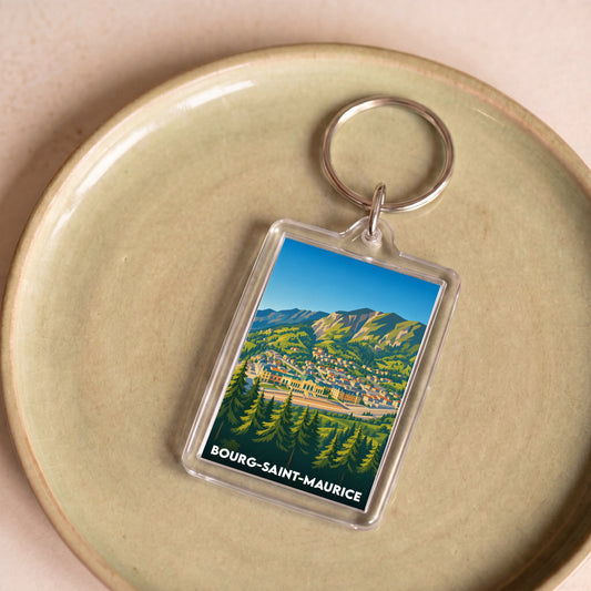 Porte-clés souvenir de la ville de Bourg-Saint-Maurice avec une illustration stylisée de montagne.