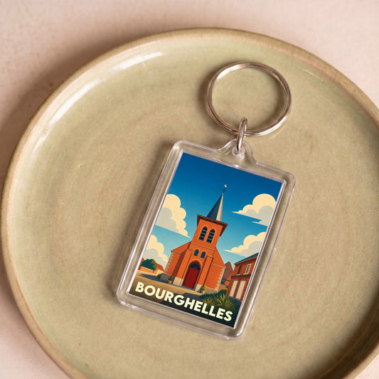 Porte-clés souvenir de la ville de Bourghelles avec une illustration stylisée de son église.