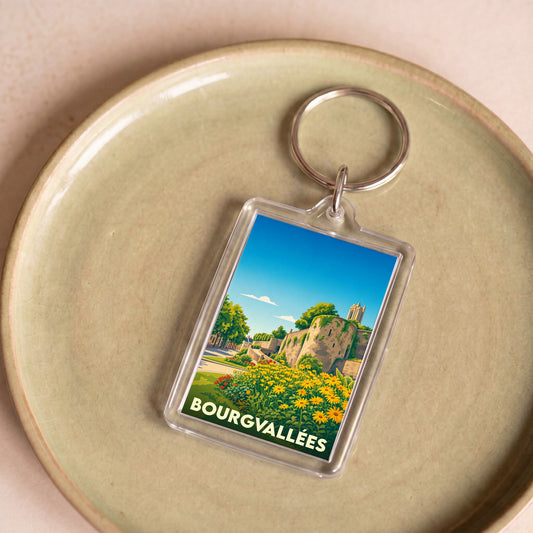 Porte-clés souvenir de la ville de Bourgvallées avec une illustration stylisée.