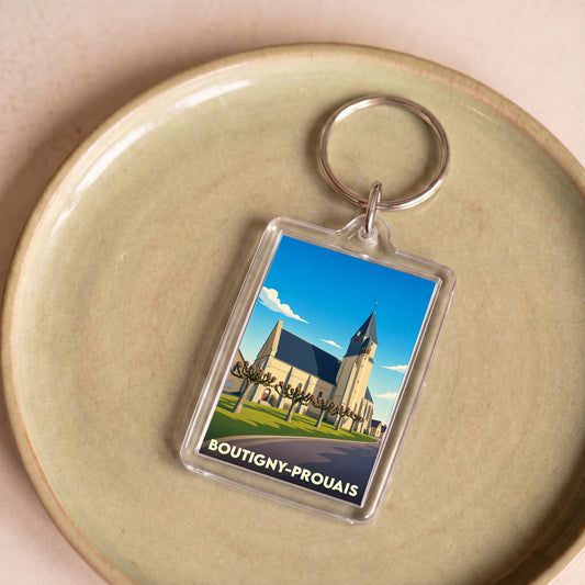 Porte-clés souvenir de la ville de Boutigny-Prouais avec une illustration stylisée de son église.