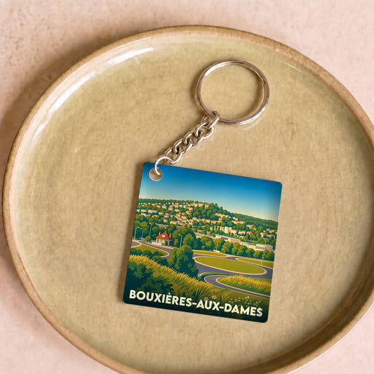 Porte-clés souvenir de la ville de Bouxières-aux-Dames avec une illustration stylisée.