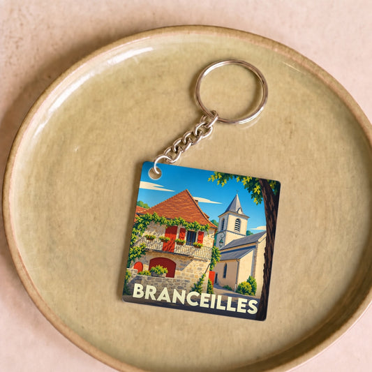 Porte-clés souvenir de la ville de Branceilles avec une illustration colorée et stylisée.