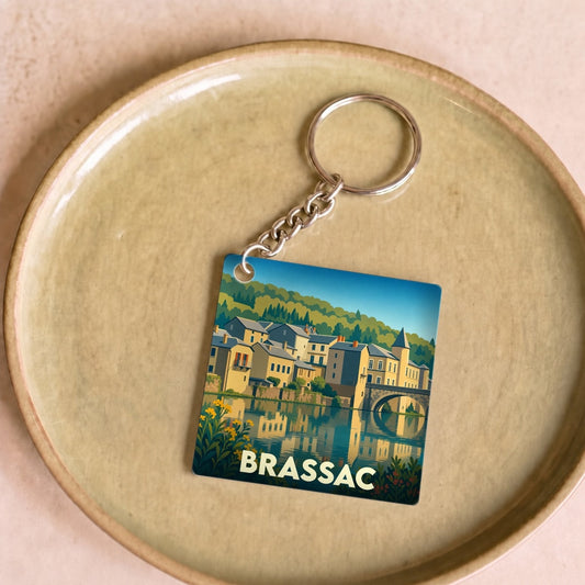 Porte-clés souvenir de la ville de Brassac avec une illustration stylisée.