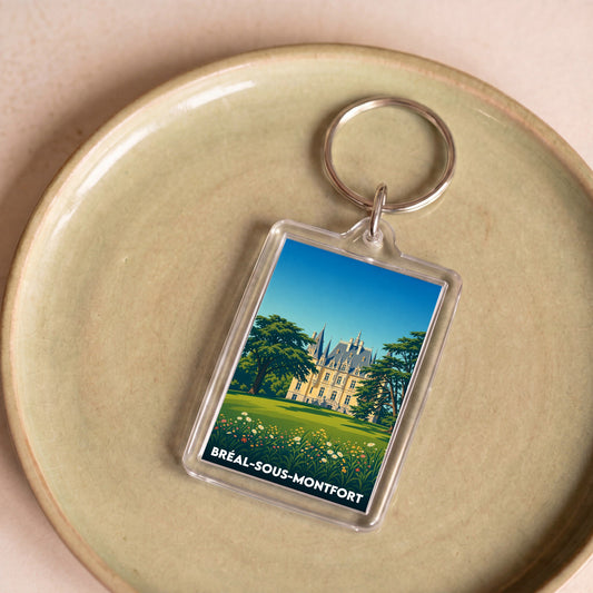 Porte-clés souvenir de la ville de Bréal-sous-Montfort avec une illustration stylisée de son château.
