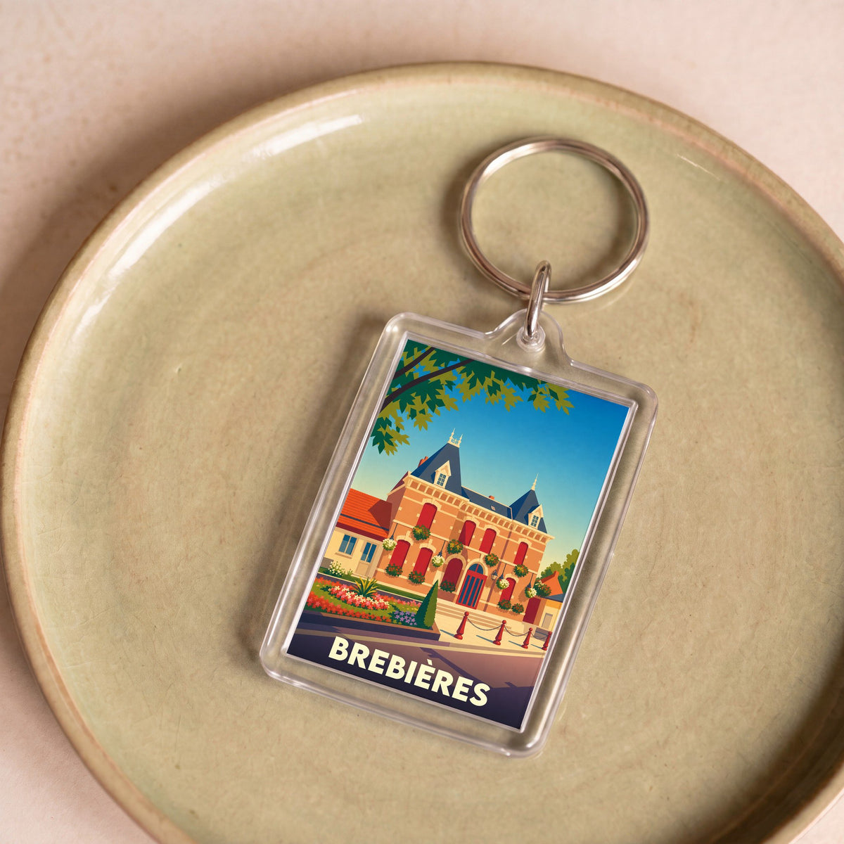 Porte-clés souvenir de la ville de Brebières avec une illustration stylisée de l'hôtel de ville.
