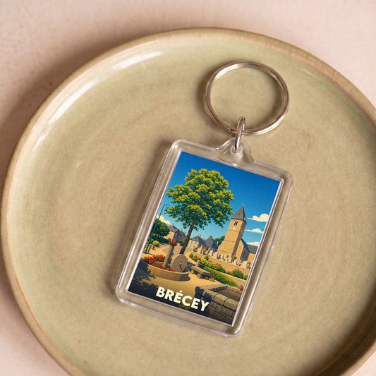 Porte-clés souvenir de la ville de Brécey avec une illustration stylisée.