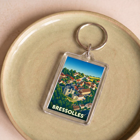 Porte-clés souvenir de la ville de Bressolles avec une illustration stylisée.