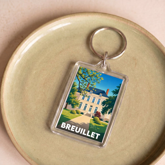 Porte-clés souvenir de la ville de Breuillet avec une illustration stylisée.