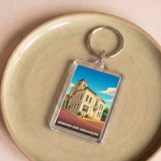Porte-clés souvenir de la ville de Brienon-sur-Armançon avec une illustration stylisée.