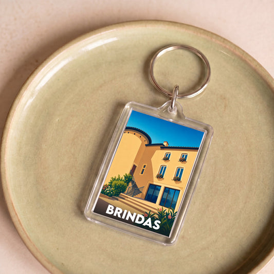Porte-clés souvenir de la ville de Brindas avec une illustration stylisée d'un bâtiment local.