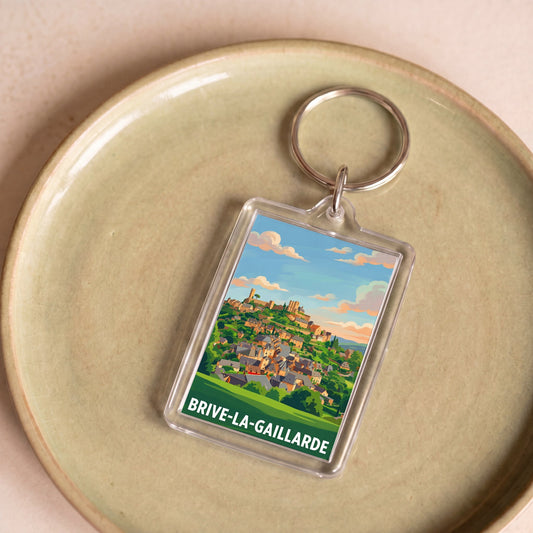 Porte-clés souvenir de la ville de Brive-la-Gaillarde avec une illustration stylisée.