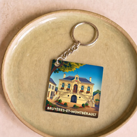 Porte-clés souvenir de la ville de Bruyères-et-Montbérault avec une illustration stylisée de sa mairie.
