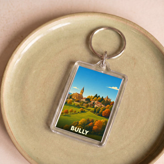Porte-clés souvenir de la ville de Bully avec une illustration stylisée de son paysage.