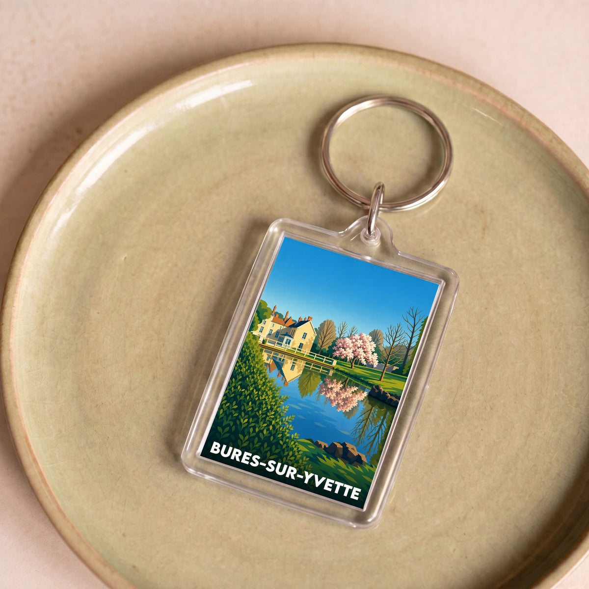 Porte-clés souvenir de la ville de Bures-sur-Yvette avec une illustration stylisée et colorée.