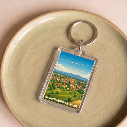 Porte-clés souvenir de la ville de Burnhaupt-le-Haut avec une illustration stylisée.