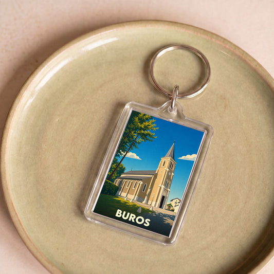 Porte-clés souvenir de la ville de Buros avec une illustration stylisée de son église.