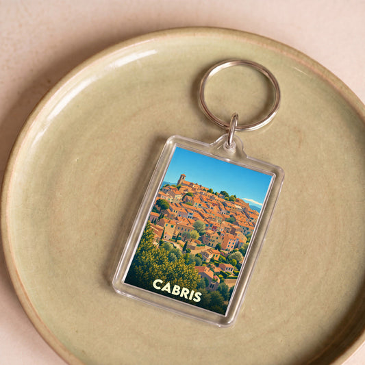 Porte-clés souvenir de la ville de Cabris avec une illustration stylisée.