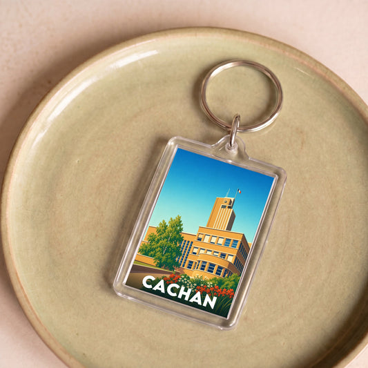 Porte-clés souvenir de la ville de Cachan avec une illustration stylisée de son hôtel de ville.