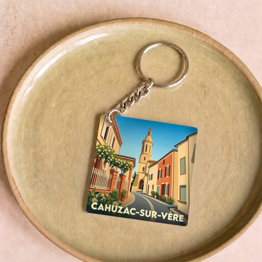 Porte-clés souvenir de la ville de Cahuzac-sur-Vère avec une illustration stylisée.