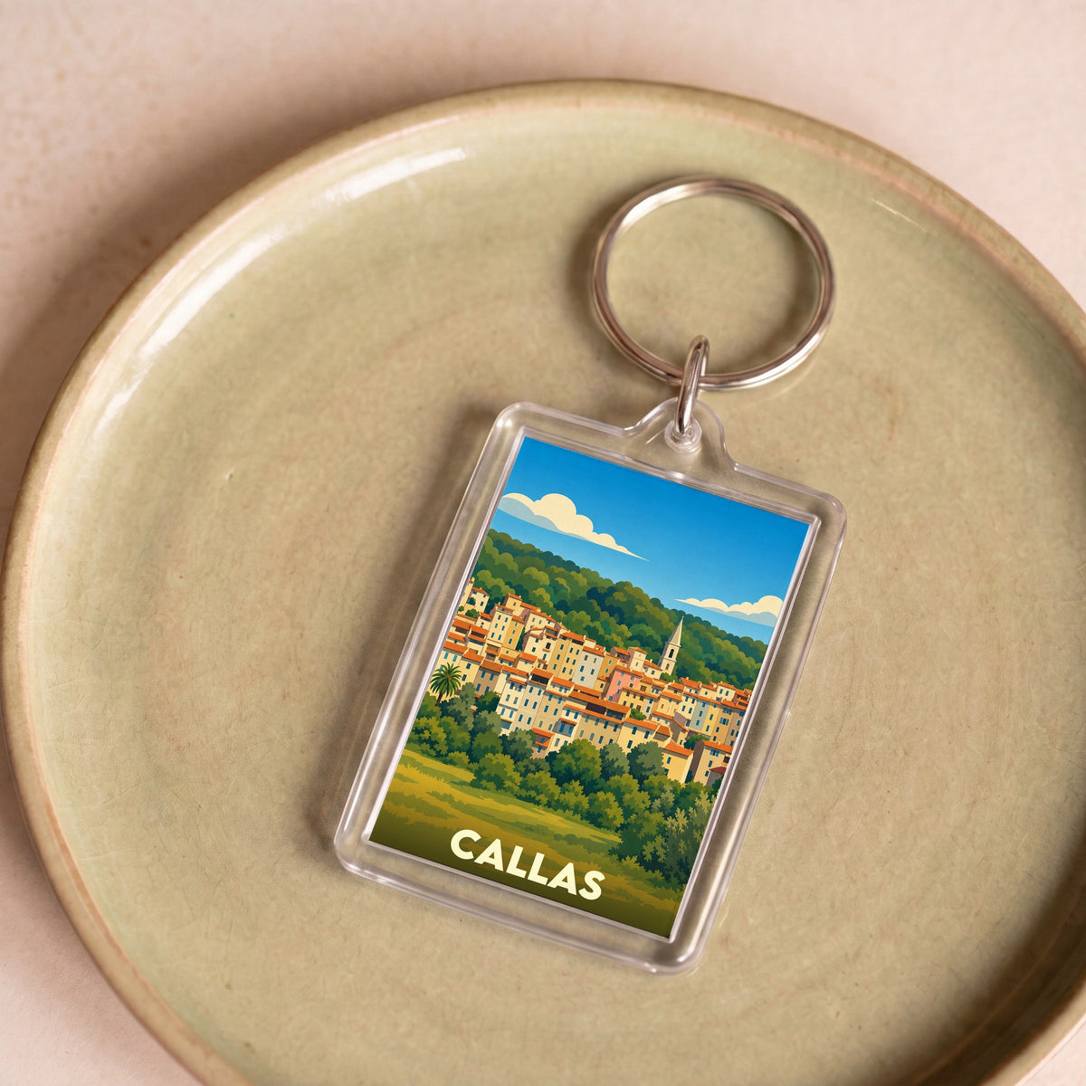 Porte-clés souvenir de la ville de Callas avec une illustration stylisée.