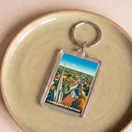 Porte-clés souvenir de la ville de Camblanes-et-Meynac avec une illustration stylisée.