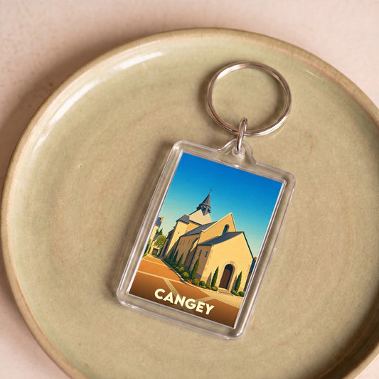 Porte-clés souvenir de la ville de Cangey avec une illustration stylisée de son église.