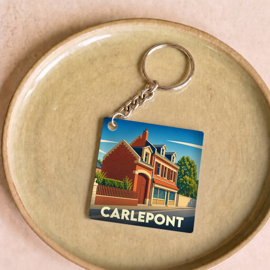 Porte-clés souvenir de la ville de Carlepont avec une illustration stylisée.