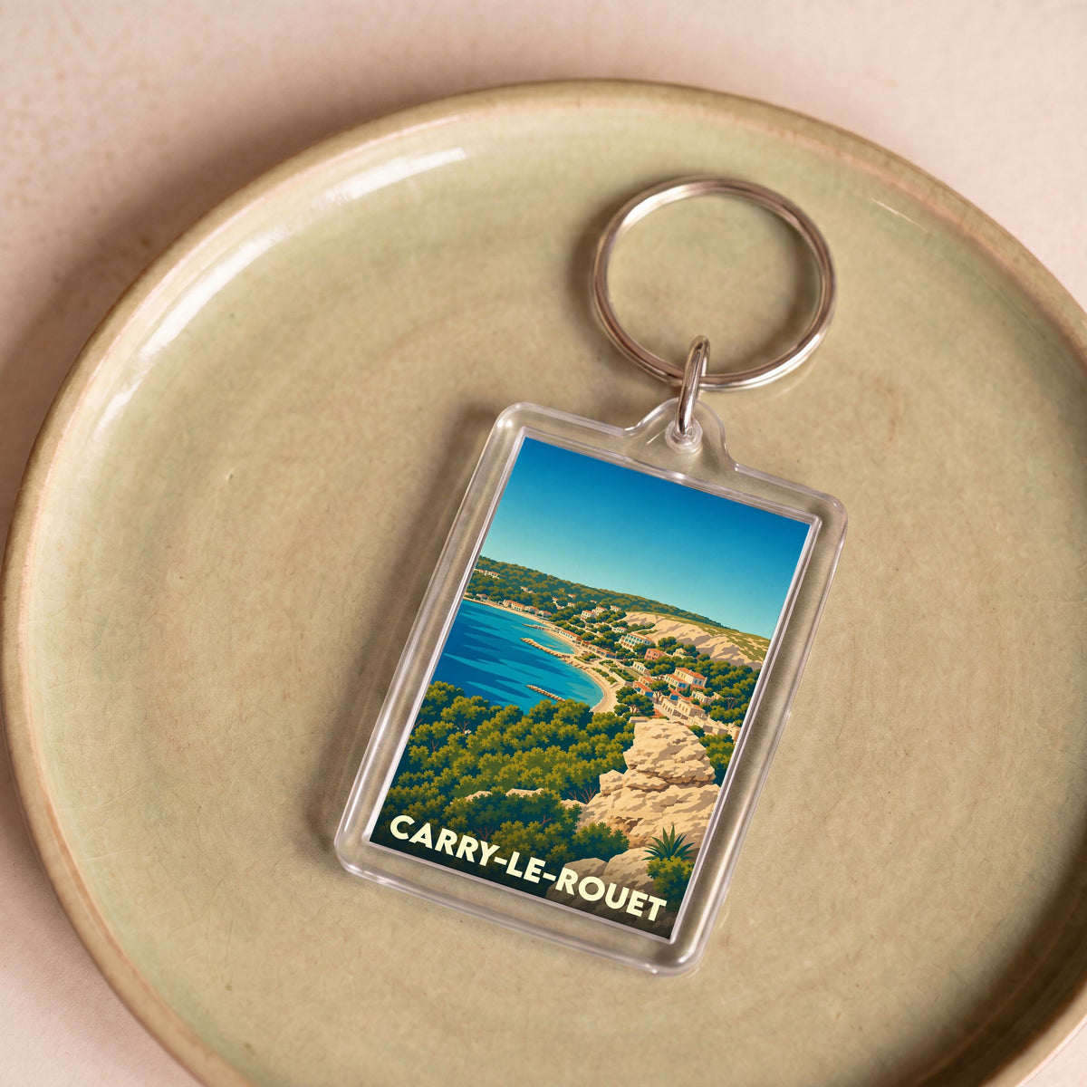 Porte-clés souvenir de la ville de Carry-le-Rouet avec une illustration stylisée de son littoral.