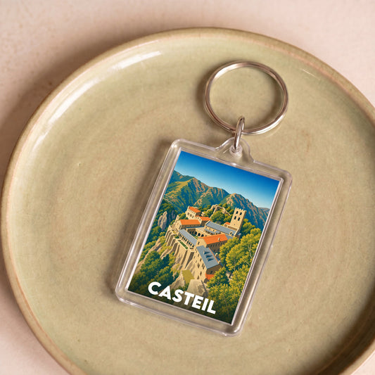 Porte-clés souvenir de la ville de Casteil avec une illustration stylisée.