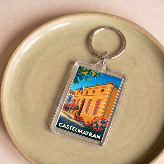 Porte-clés souvenir de la ville de Castelmayran avec une illustration stylisée de sa mairie.