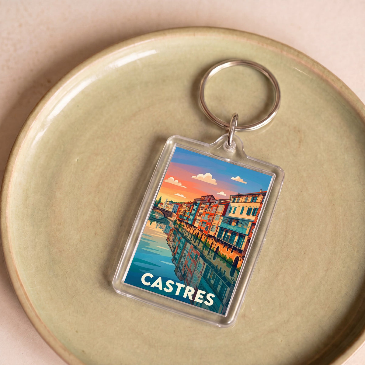 Porte-clés souvenir de la ville de Castres avec une illustration stylisée.