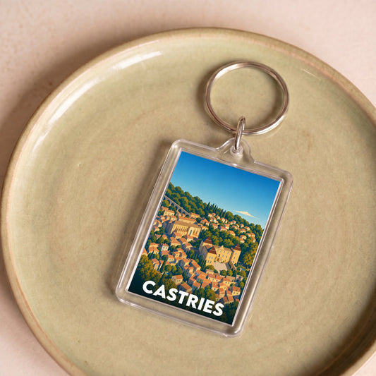Porte-clés souvenir de la ville de Castries avec une illustration stylisée.